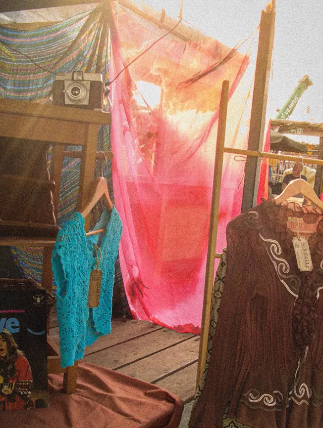 Birdie's market stall with crochet top and silk drapes